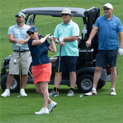 A group of people playing golf
